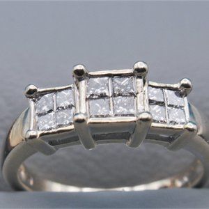 3 carat total weight 14 kt white gold diamond ring. 3 stone Princess cut dia